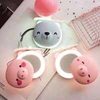 Piggy Glow – 3-in-1 Pocket Fan, LED Mirror & Light